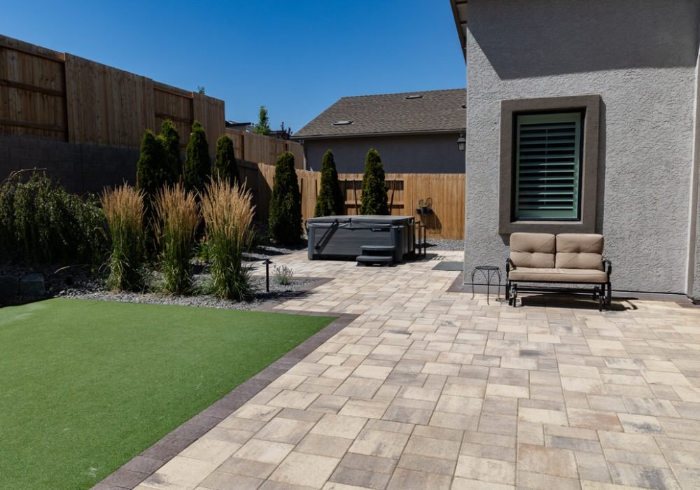 Patio pavers with Hot tub and synthetic turf