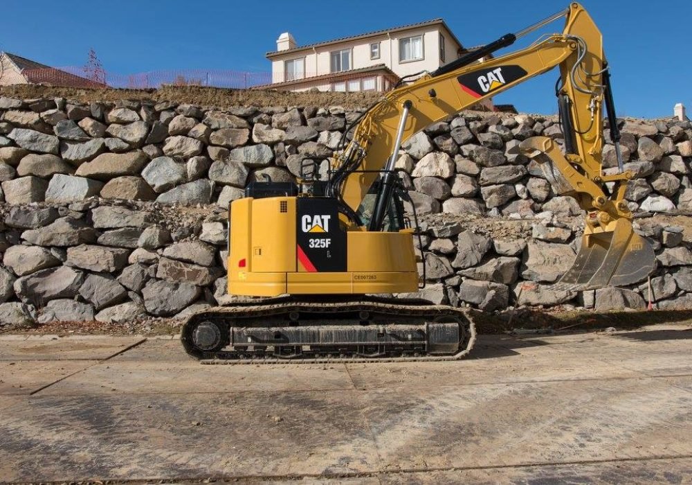 Building rock wall for commercial site with boulders by Gail Willey Landscaping In Reno, Nevada