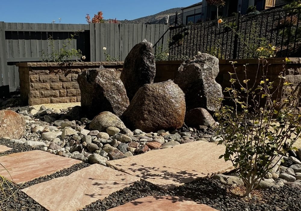 Grouping of Cored boulders water feature