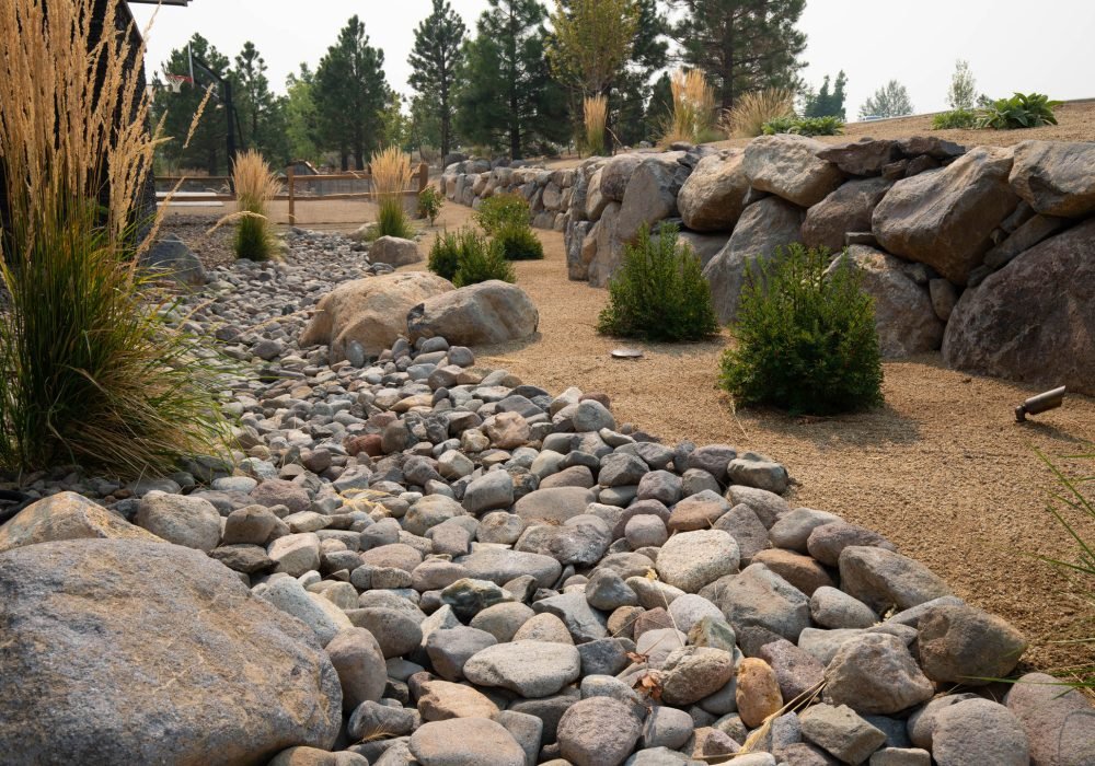 Xeriscape landscaping with cry creek, boulders and native water wise plants